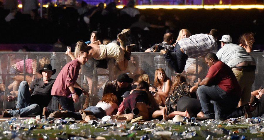 People+dive+over+a+barricade+to+get+out+of+the+shooters+line+of+fire+at+a+Country+Music+Festival+in+Los+Vegas.+source%3A+abcnews.com