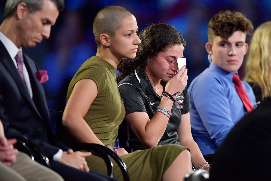 Marjory+Stoneman+Douglas+High+School+student+Emma+Gonzalez+%28center%29+has+become+the+face+of+student+activism+in+the+wake+of+the+Parkland+shooting.+Source%3A+people.com