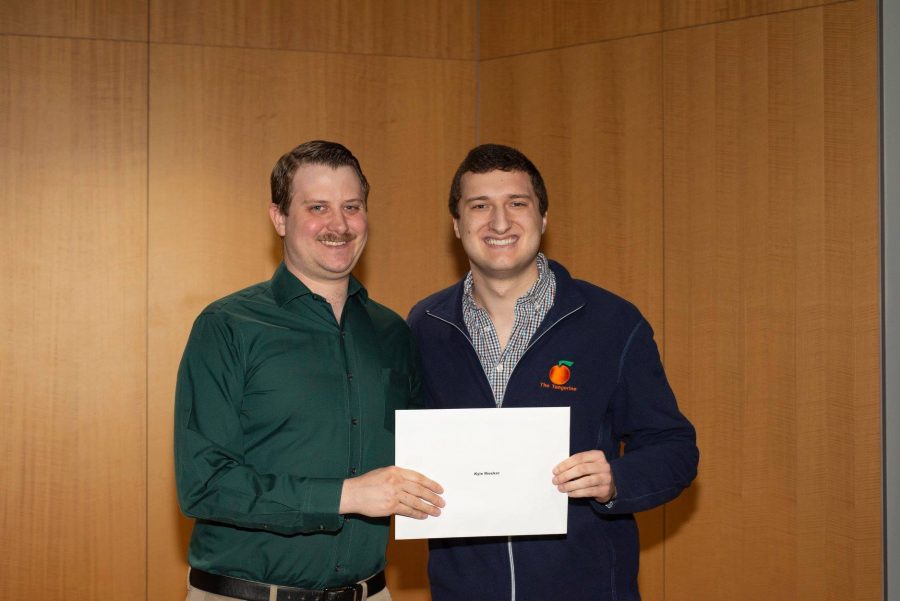 Kyle Riecker (left) and Sam Northrup (right) during the 2019 Raymond Simon Institute awards ceremony. After two years, Northrup will be retiring as editor-in-chief of The Tangerine. Source: Raymond Simon Institute
