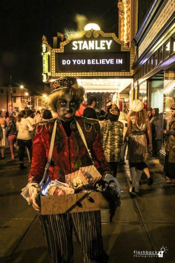 Franny Wagner poses as an undead concession worker in front of the Stanley Theater at the 2014 Utica Zombie Walk. Photo by Flashback Photography.