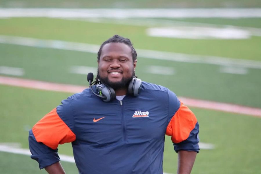 Coach Tracy Branch on the sideline before a Utica College football game.