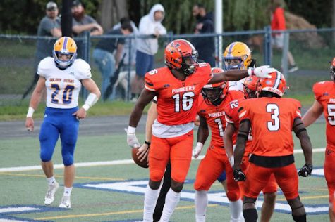 Utica College celebrates touchdown in 37-28 victory vs. Western New England.