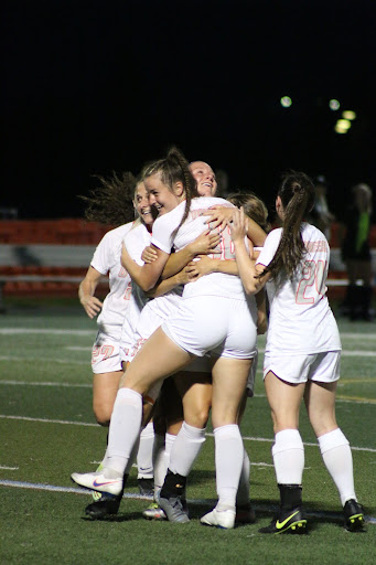 Kaela Mochak celebrates with teammates after her 35 yard missile gives her a spot on SportsCenters Top 10 Plays.