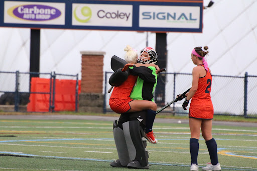 Senior teammate Lexi Scaccia celebrates with goalie Megan Chamberlain as she becomes the all-time saves leader in Utica College Field Hockey History. 