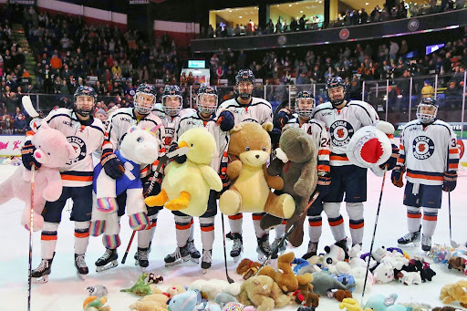 Members of the Utica College mens ice hockey team during the 17th annual New York SASH Teddy Bear Toss.