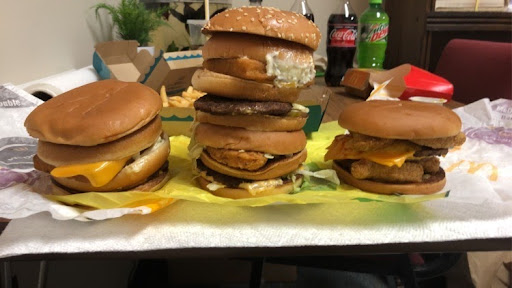 Three of the four McDonalds menu hacks Matthew Breault consumed. From left:  Surf + Turf, Land Air & Sea, Crunchy Double.
