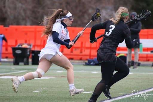 Kelsey Trainor runs up the field with the ball.