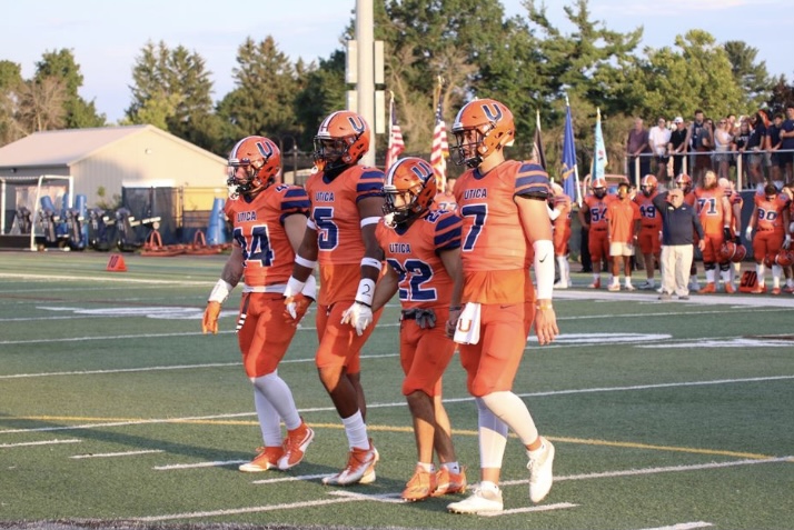 Photo: Kayleigh Sturtevant/ The four captains for the Utica University Pioneers walking out for the coin toss. 