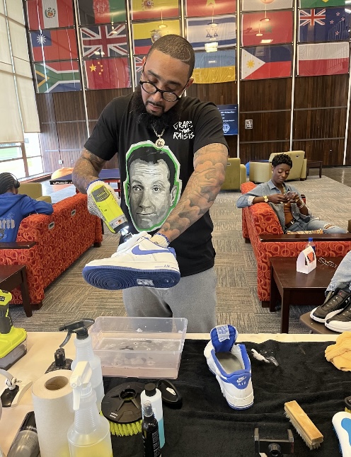 Photo Credits: Vasyl Yurkuts, Dr. Crisp cleaning his AirForce 1s sneakers at Feet Heat event. 