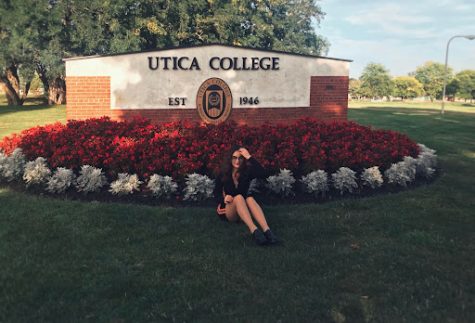 Mariami pictured in front of the Utica University entrance.