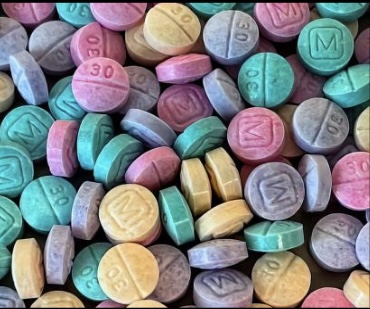 Google image. A photo of a random assortment of drugs, as mentioned in the article. Fentanyl, adderall, and other pill drugs.