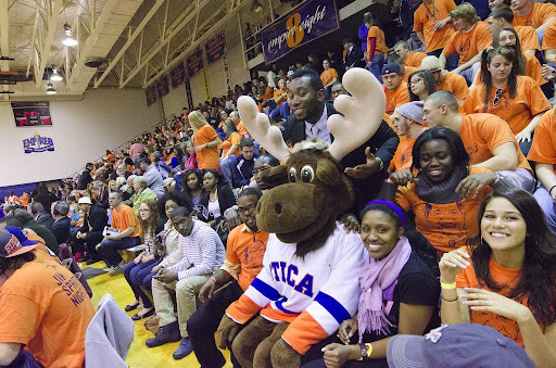 Trax attends a home basketball game to cheer and show his school spirit.