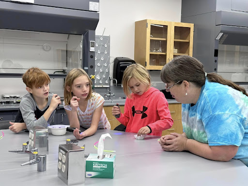 Visiting students learn in Uticas lab facilities, alongside future educators and Utica staff.