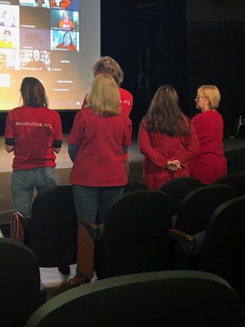 Members of the AAUP Utica, dressed in their signature red, attending the faculty presentation in-person on Jan. 18.