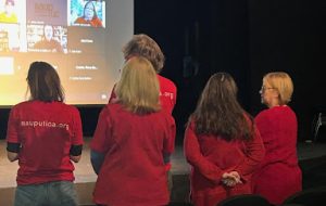 Members of the AAUP Utica, dressed in their signature red, attending the faculty presentation in-person on Jan. 18.