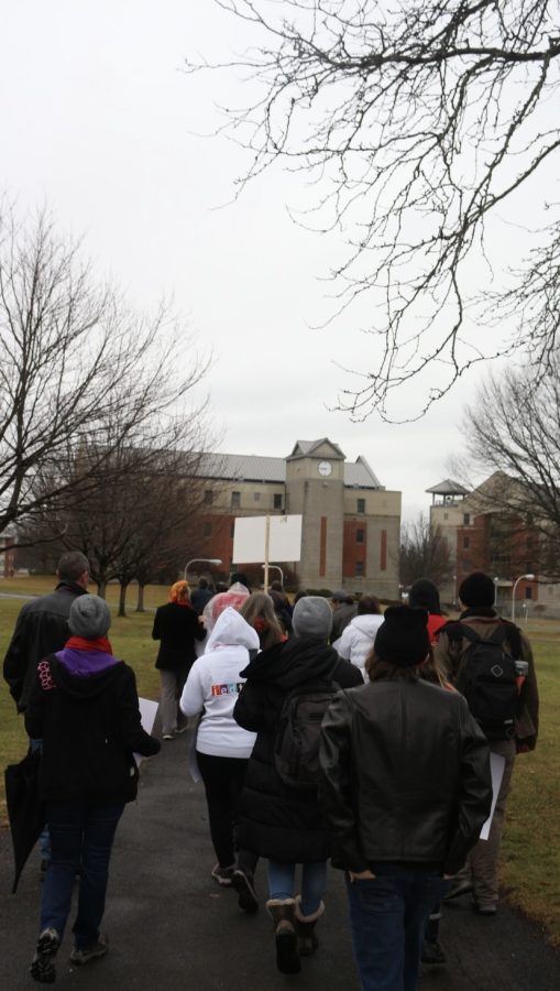 A photograph of students and faculty marching along Utica Universitys campus in the Rally to Save Utica. 
Photo by Michal Kozub