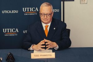 Todd Pfannestiel reading his remarks after the announcement was made that he will be Utica University's 10th president.