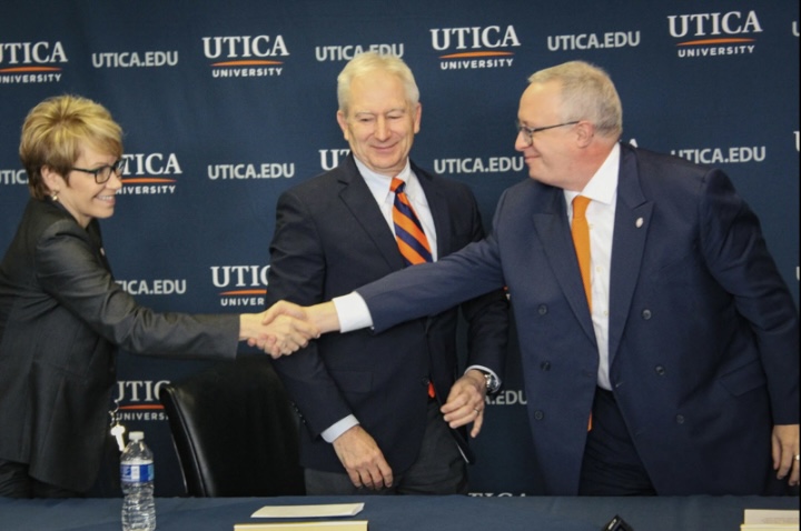 Dr. Todd Pfannestiel shaking hands with current President Casamento while being introduced as the new University president effective next semester. 