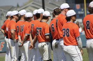 Baseball team line up for game. 
