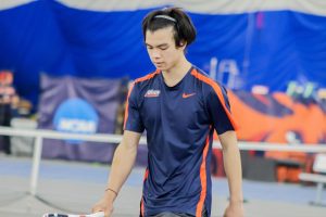 A Utica tennis player looks down during a tennis match.