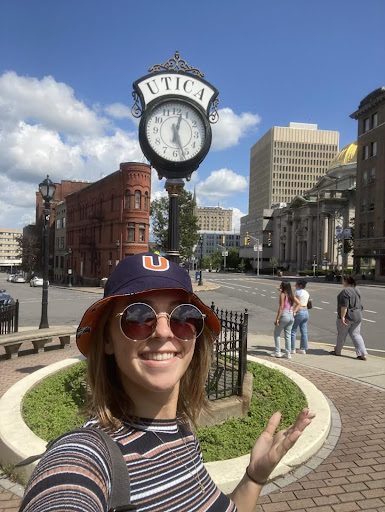 Jennifer Sadowska poses in front of a Utica street clock. 