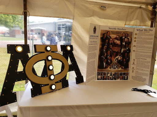 Alpha Phi Alpha Greek letters on display. 

