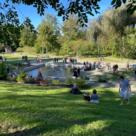 Visitors gather around the iconic Lily Pond on the plateau between the upper and lower parts of F.T. Proctor Park. 