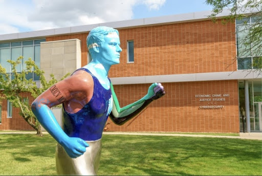 “Runner with a Heart” statue located outside of White hall. Courtesy of The Tangerine’s photo file
