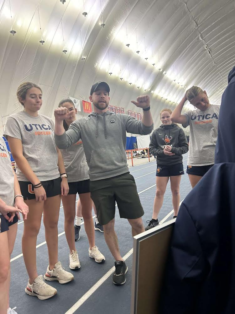 Nate Fredsell, Utica’s strength and conditioning coach, talks to university athletes in the dome. /Photo courtesy of Jamie Eck