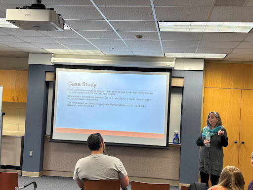 Patricia Montone Charvat, senior vice president for marketing and strategy for Mohawk Valley Health Systems in Utica, speaks about crisis communication to Media Writing class students. 
Photo by Megan Wright 