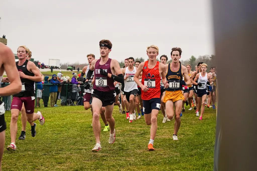Bennet Melita in orange, running in a race.
Photo courtesy of Utica University.