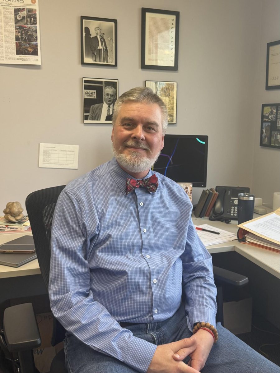 Jeff Miller, Professor of Communication, sits in his office in November 2025. Photo by Jenna Skutnik