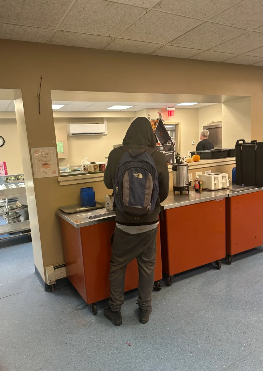 A guest at Hope House in Utica waits for lunch on an October afternoon. Photo by Elijah Chung Lewis.