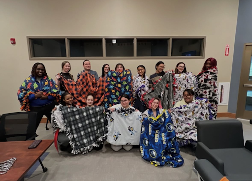 Photo of WIND members after making blankets for those in need. Photo courtesy of Marques Williams. 